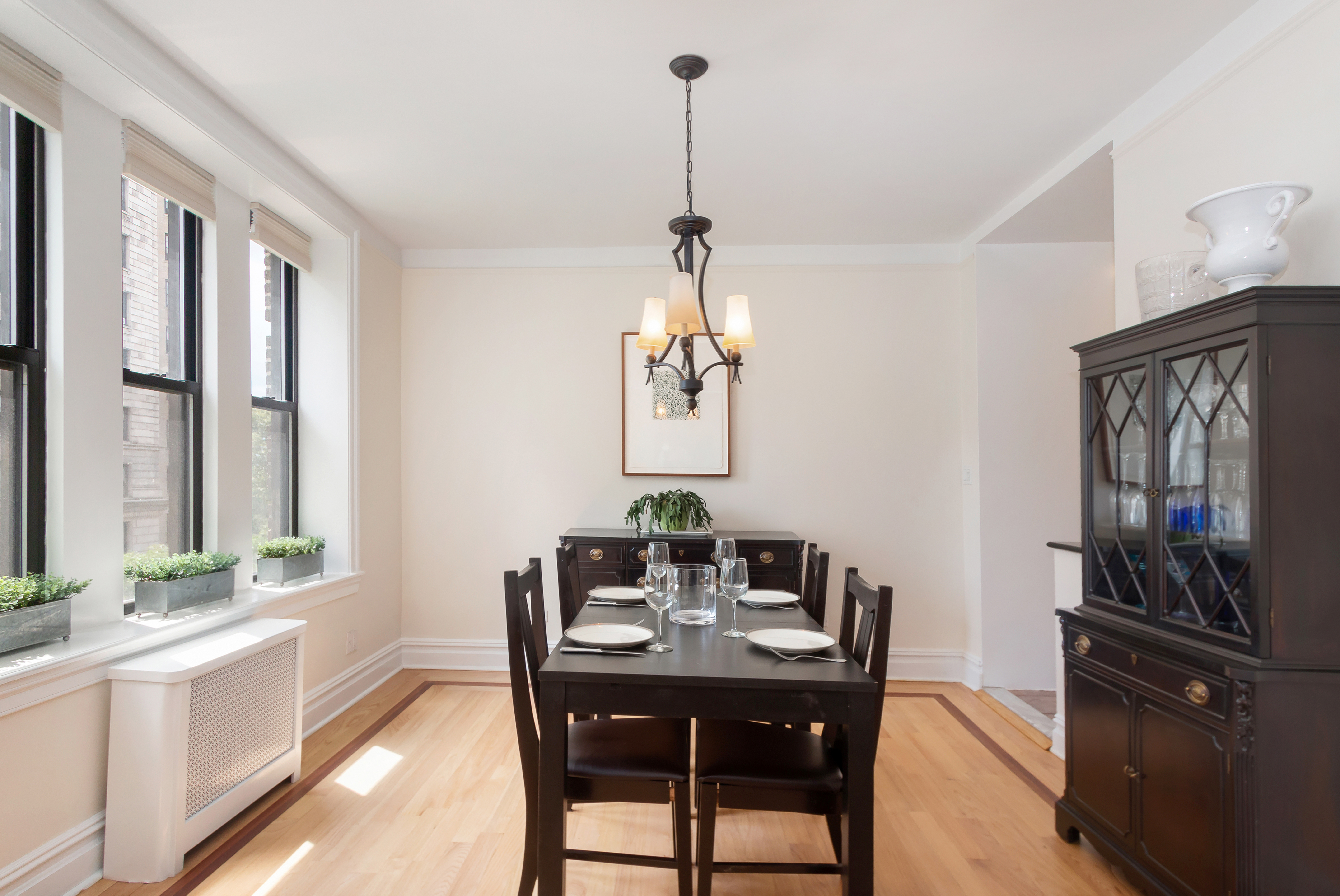 801 Riverside Drive, Unit 4F Manhattan, NY 10032 - Photo 5 of 13 a dining room with furniture a chandelier and window