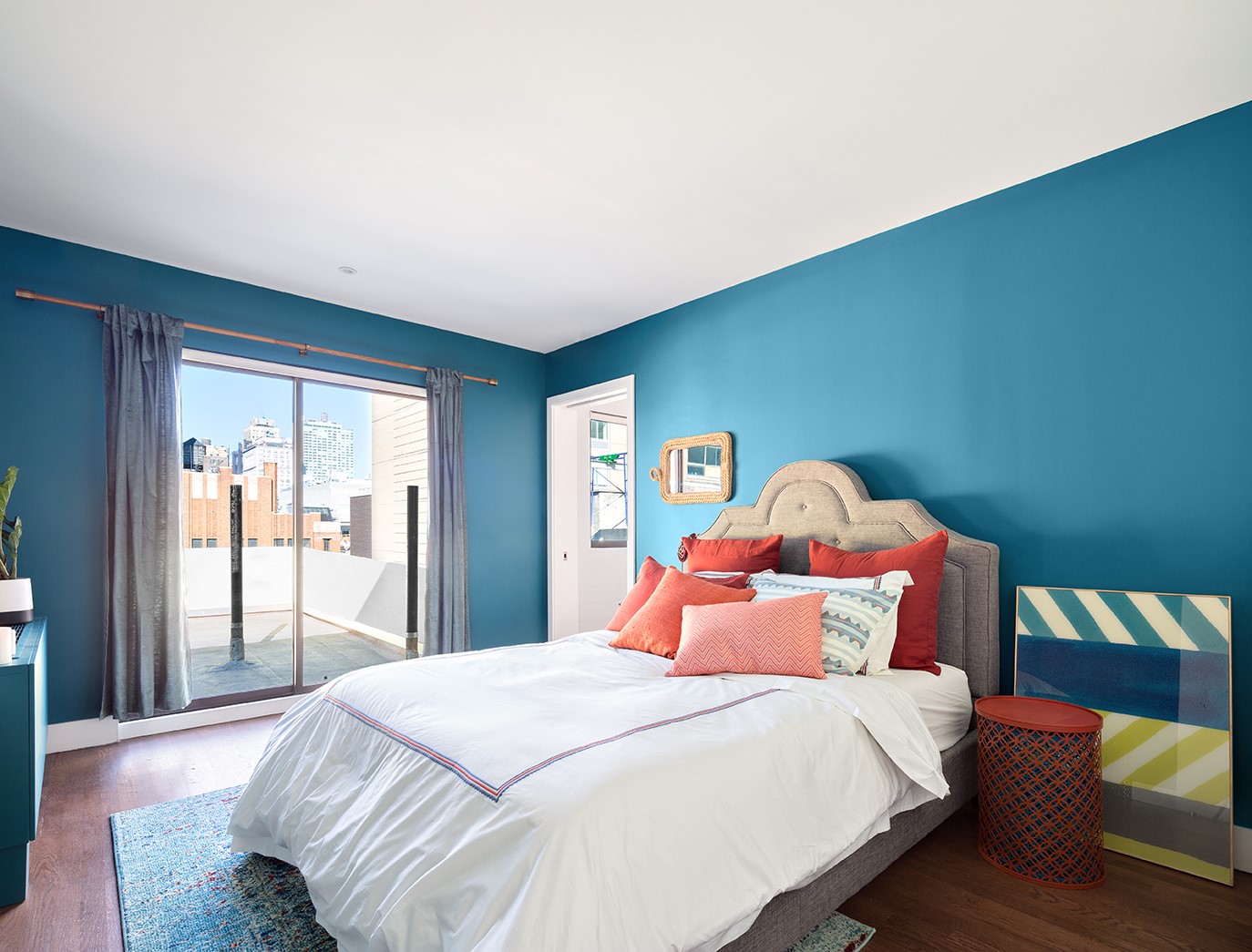 245 West 25th Street, Unit PHD Manhattan, NY 10001 - Photo 5 of 16 a bedroom with a bed and a large window