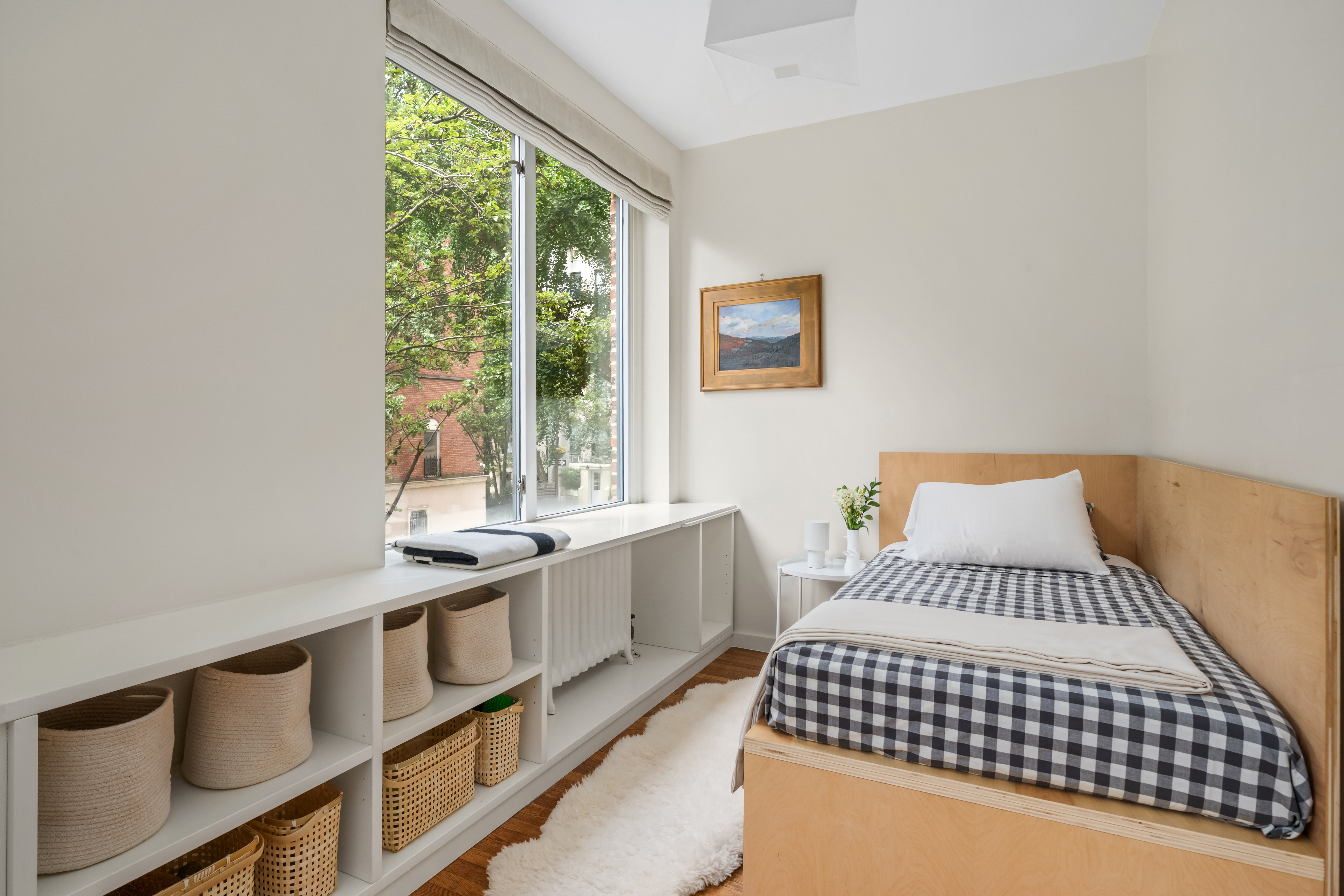 455 East 51st Street, Unit 2F Manhattan, NY 10022 - Photo 9 of 17 a bedroom with a bed and a large window