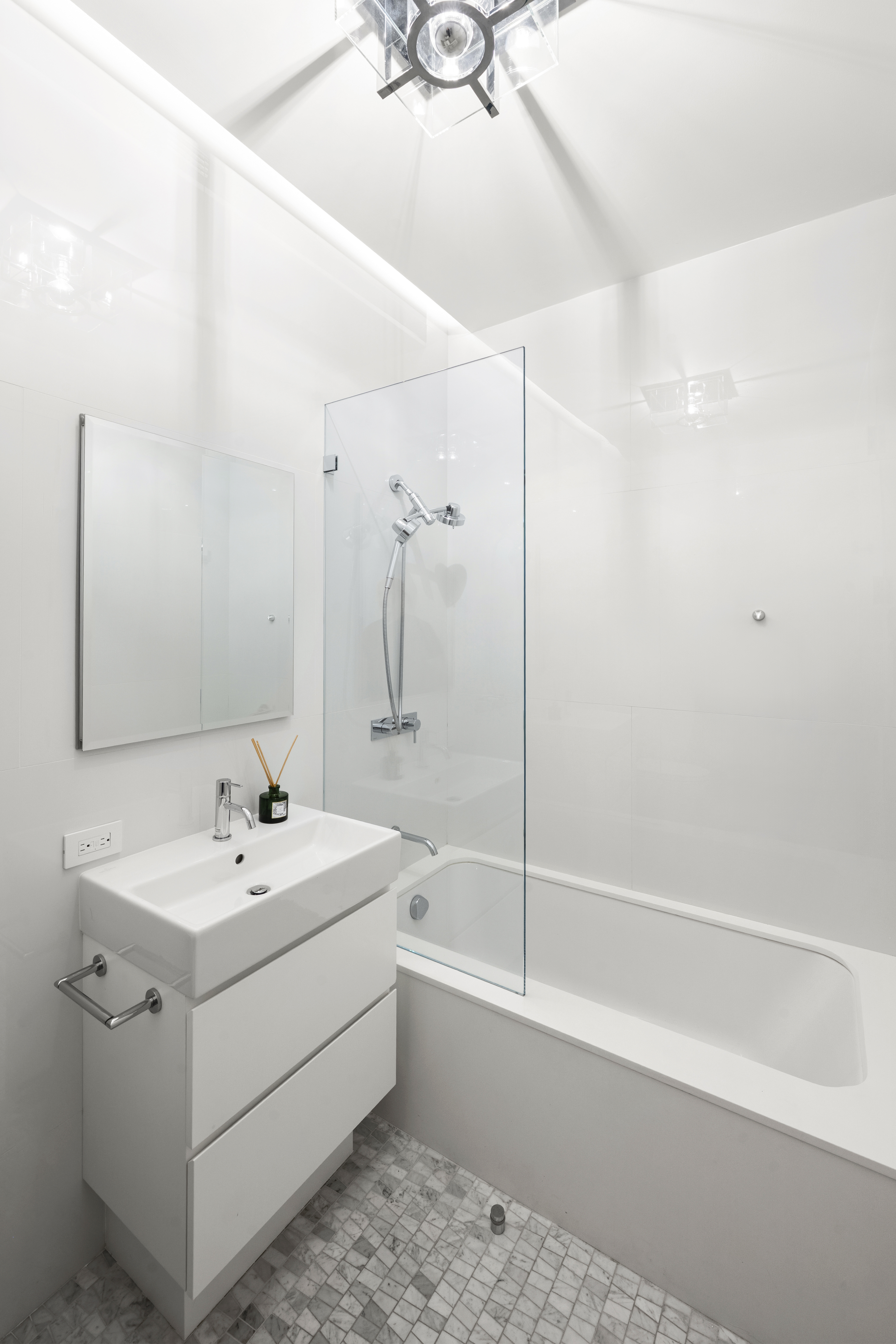 532 West 20th Street, Unit 4 Manhattan, NY 10011 - Photo 15 of 23 a bathroom with a sink a toilet and shower