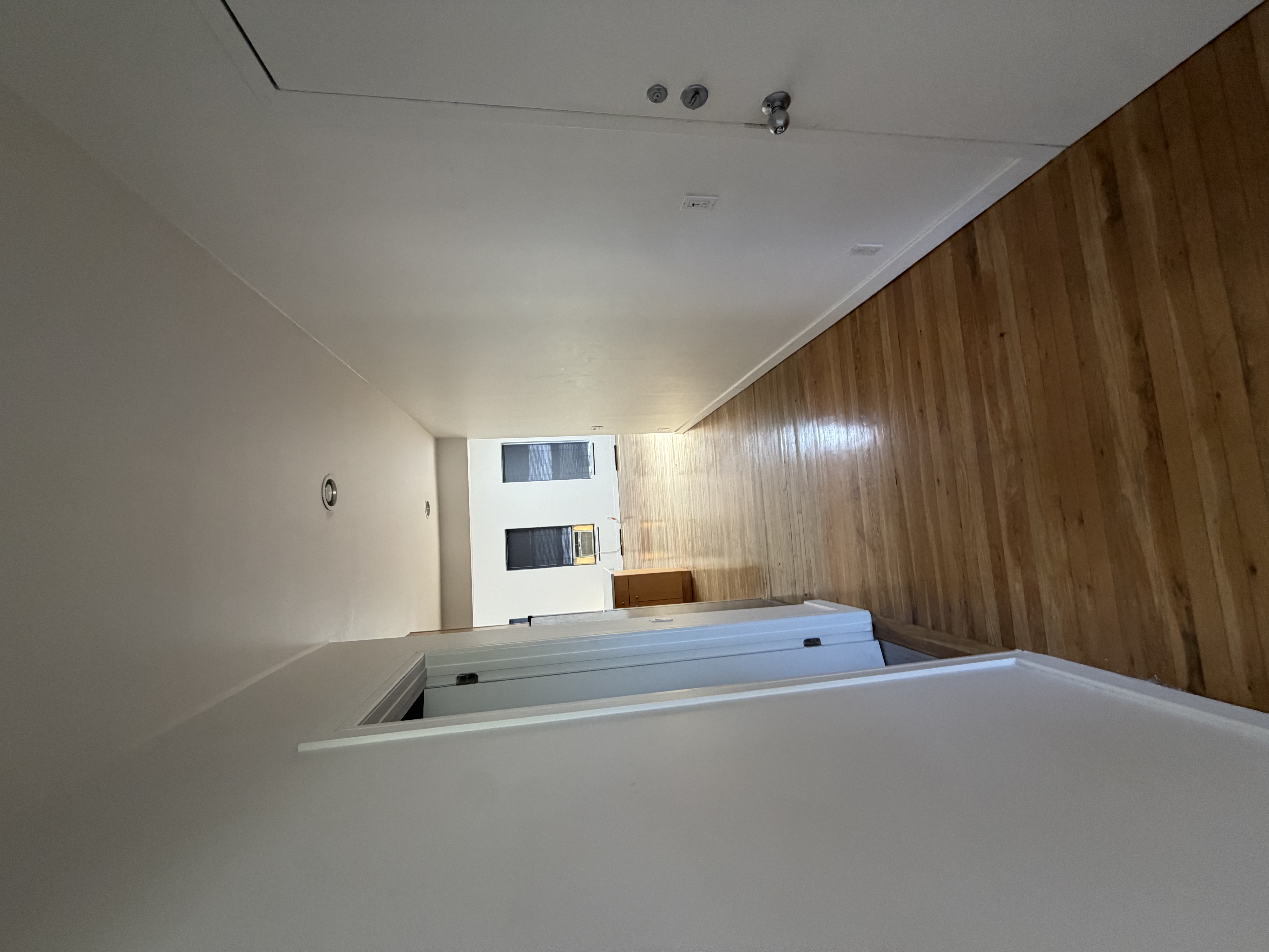 23 West 127th Street, Unit 3 Manhattan, NY 10027 - Photo 8 of 11 a view of a hallway with wooden floor and staircase