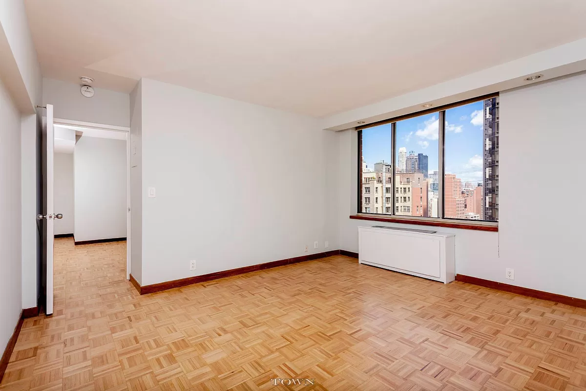 420 East 58th Street, Unit 17B Manhattan, NY 10022 - Photo 3 of 12 a view of an empty room with a window