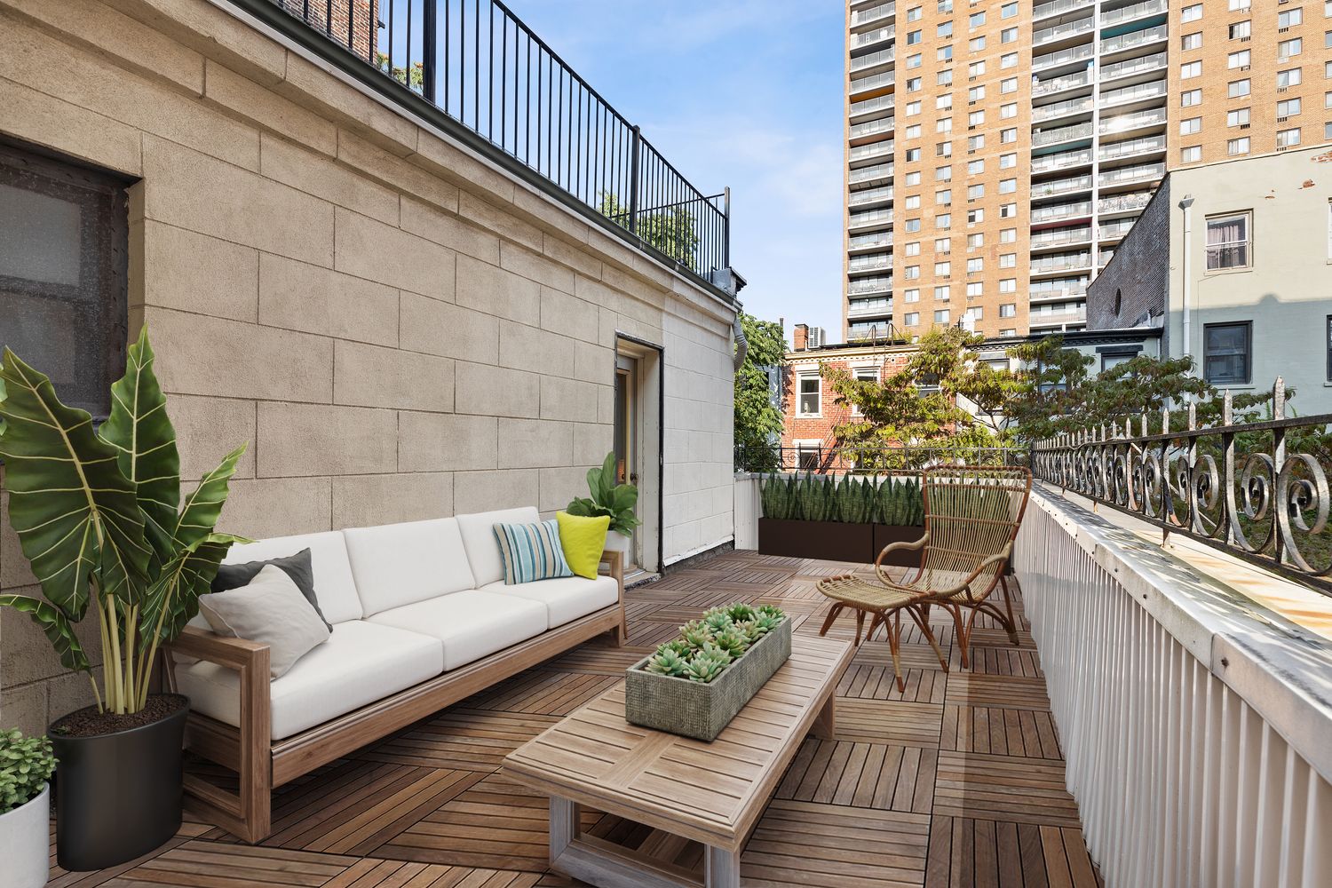 315 Washington Avenue Brooklyn, NY 11205 - Photo 14 of 38 a view of a balcony with couches and a potted plant