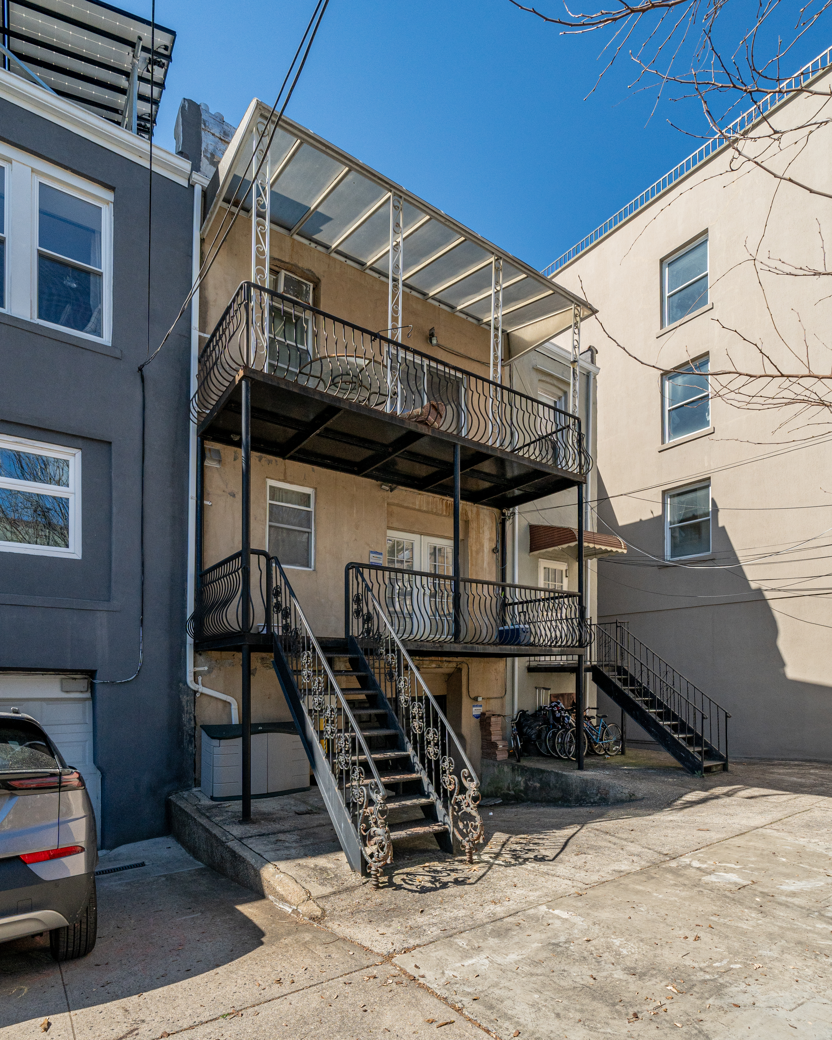 415 84th Street Brooklyn, NY 11209 - Photo 16 of 17 a view of a house with wooden stairs