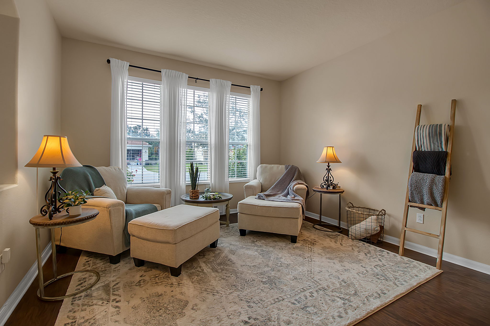 6106 34th Court East Bradenton, FL 34203 - Photo 17 of 69 a living room with furniture and a lamp