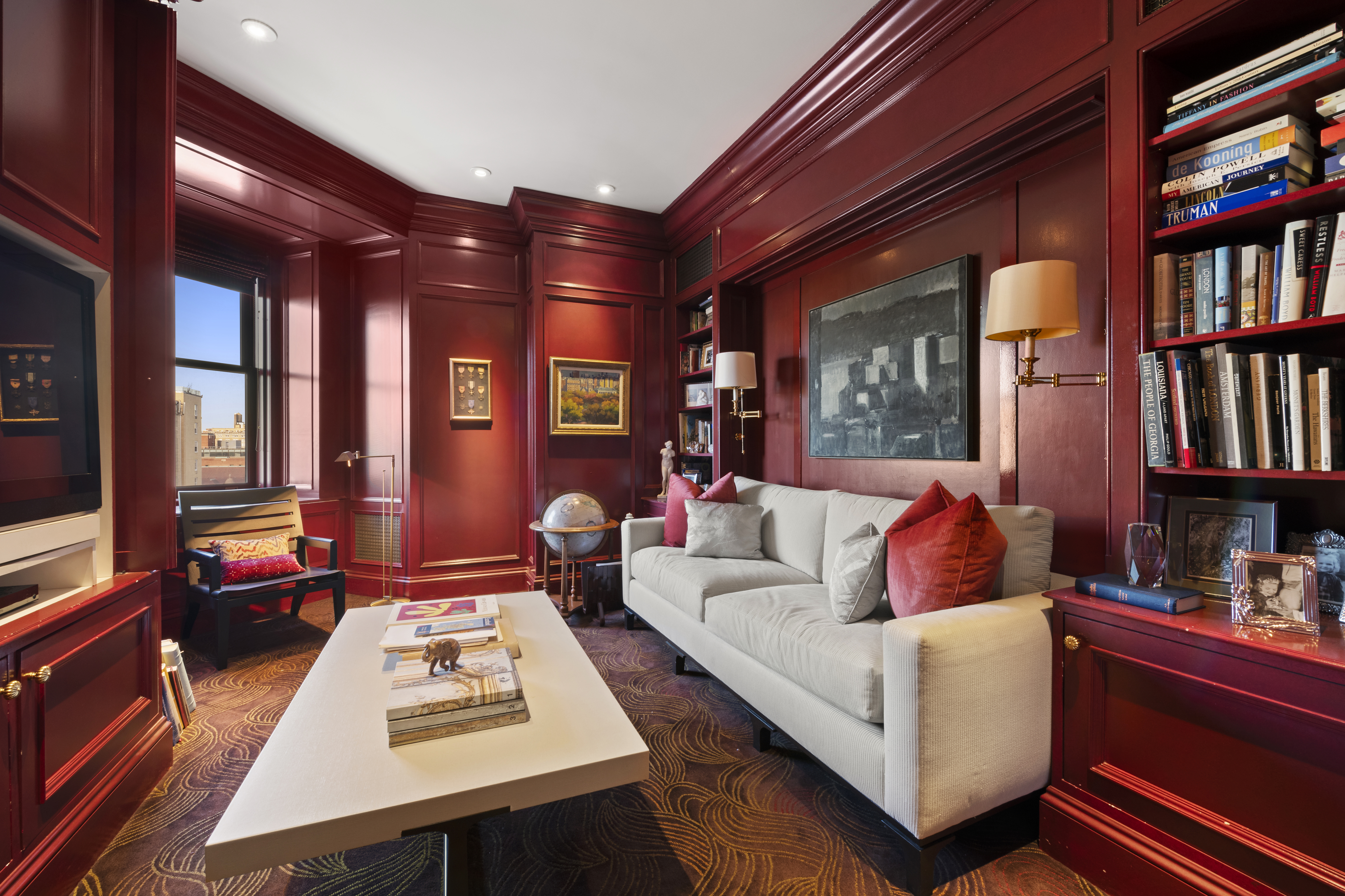 151 Central Park West, Unit 11NORTH Manhattan, NY 10023 - Photo 14 of 19 a living room with furniture a bookshelf and a window