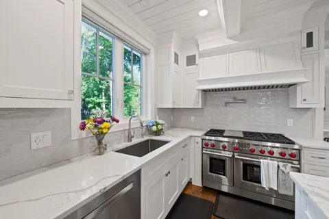 a living room with fireplace furniture and a flat screen tv