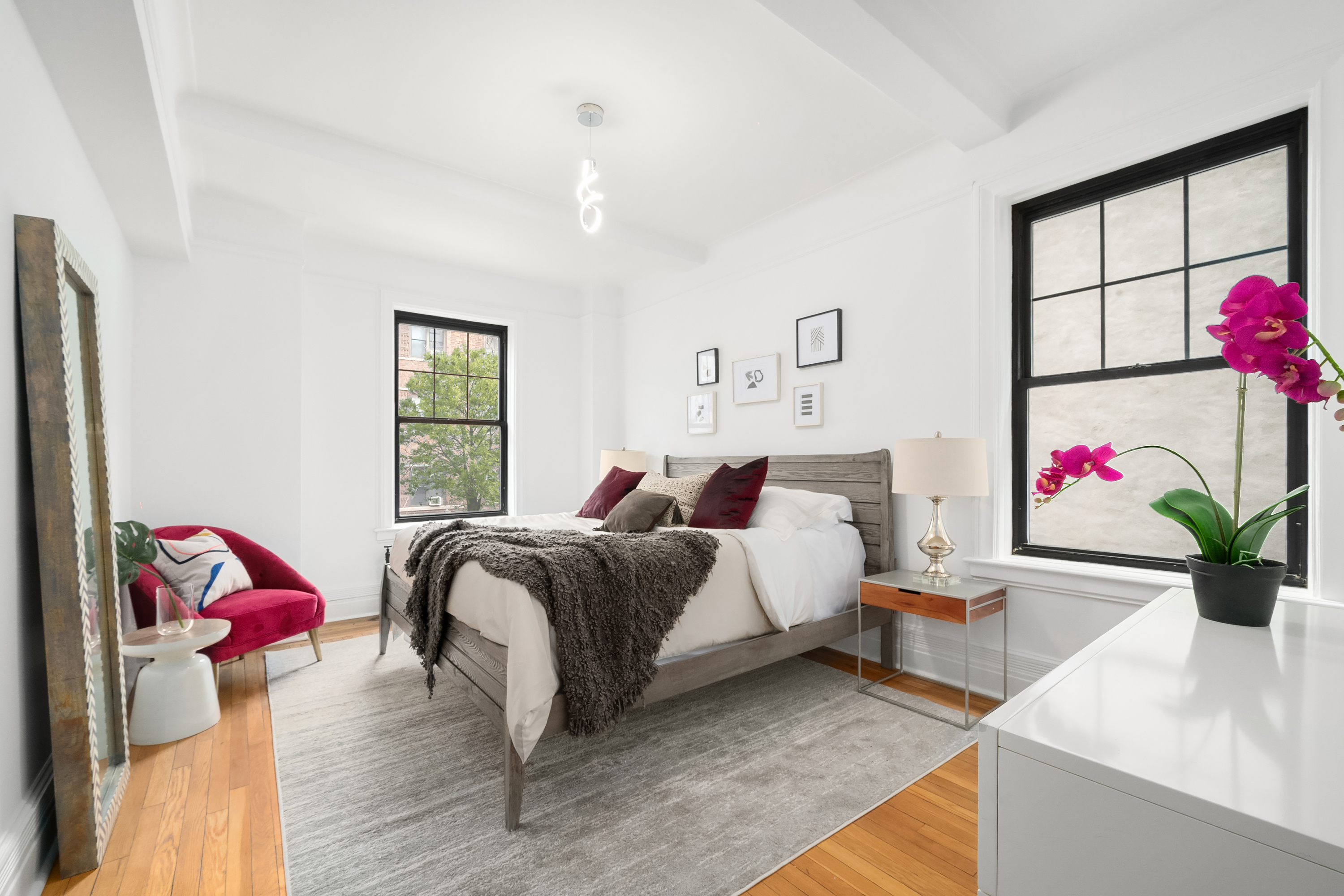 170 2nd Avenue, Unit 2D Manhattan, NY 10003 - Photo 5 of 11 a bed room with a bed and a couch