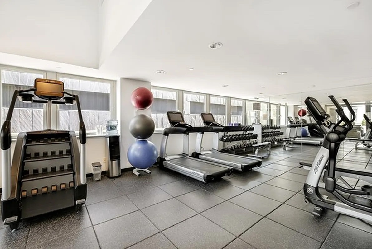 90 William Street, Unit 15F Manhattan, NY 10038 - Photo 9 of 10 a room with gym equipment and equipment