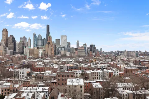 a view of a city with tall buildings