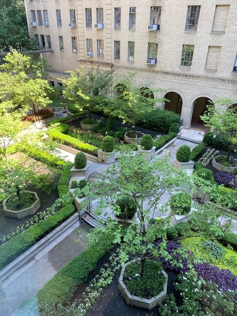 353 West 56th Street, Unit 2G Manhattan, NY 10019 - Photo 11 of 13 a view of a garden with a building in the background