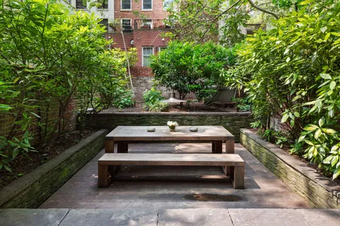 a view of a bench in a backyard