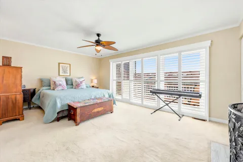 a bedroom with a bed and a table with lamp