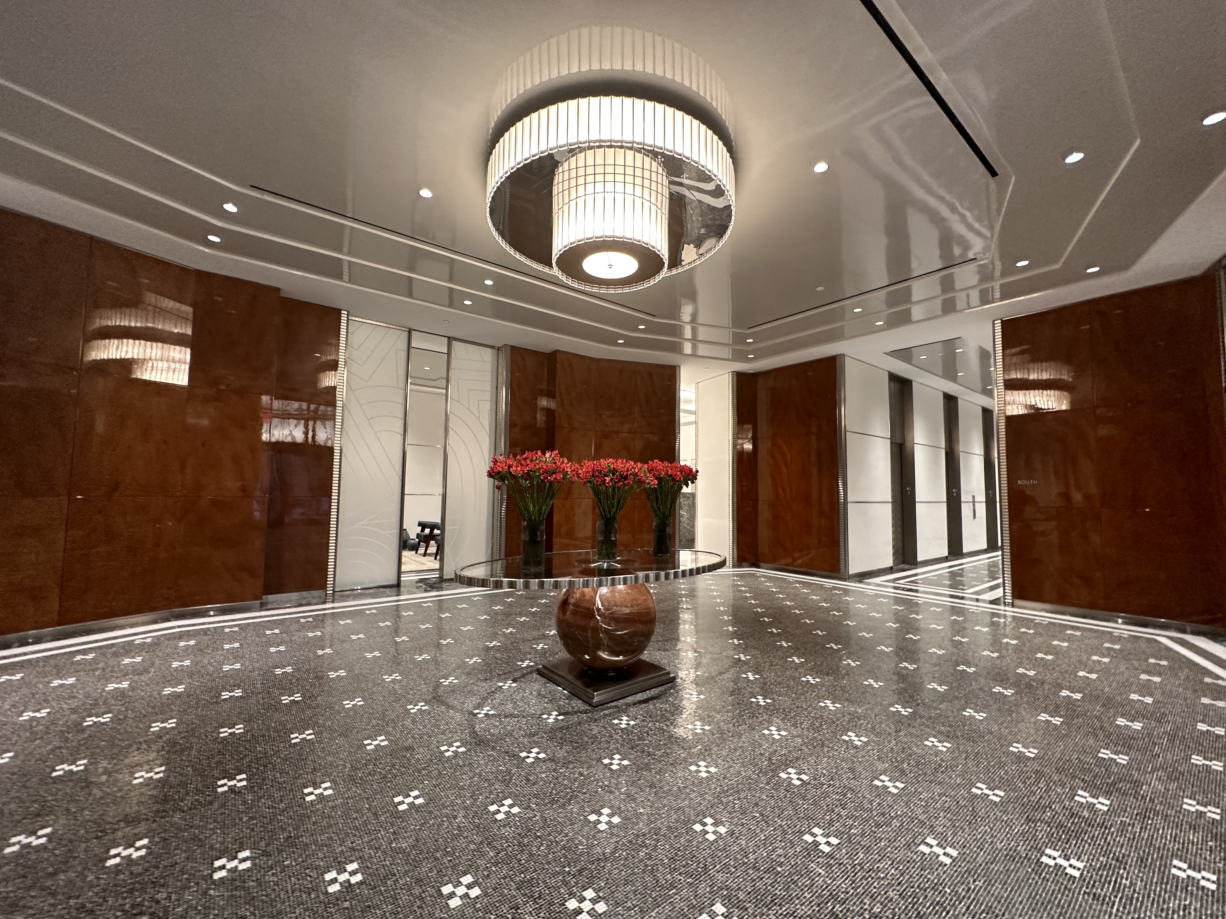 1 Wall Street, Unit 915 Manhattan, NY 10005 - Photo 9 of 18 a view of a hallway with entryway