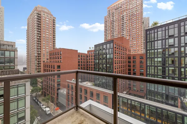 a view of a tall buildings from a balcony