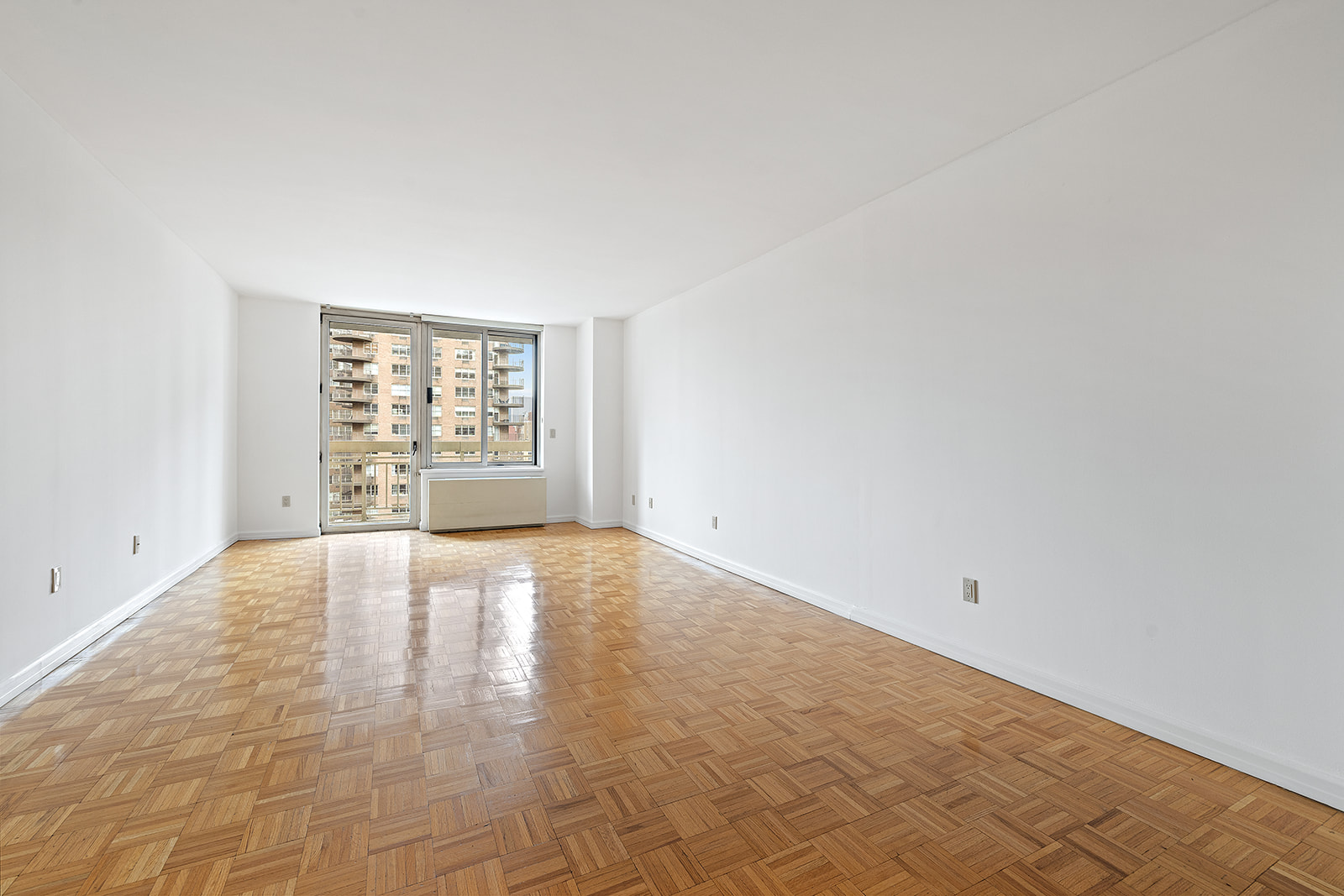 170 East 87th Street, Unit W15H Manhattan, NY 10128 - Photo 9 of 13 an empty room with windows