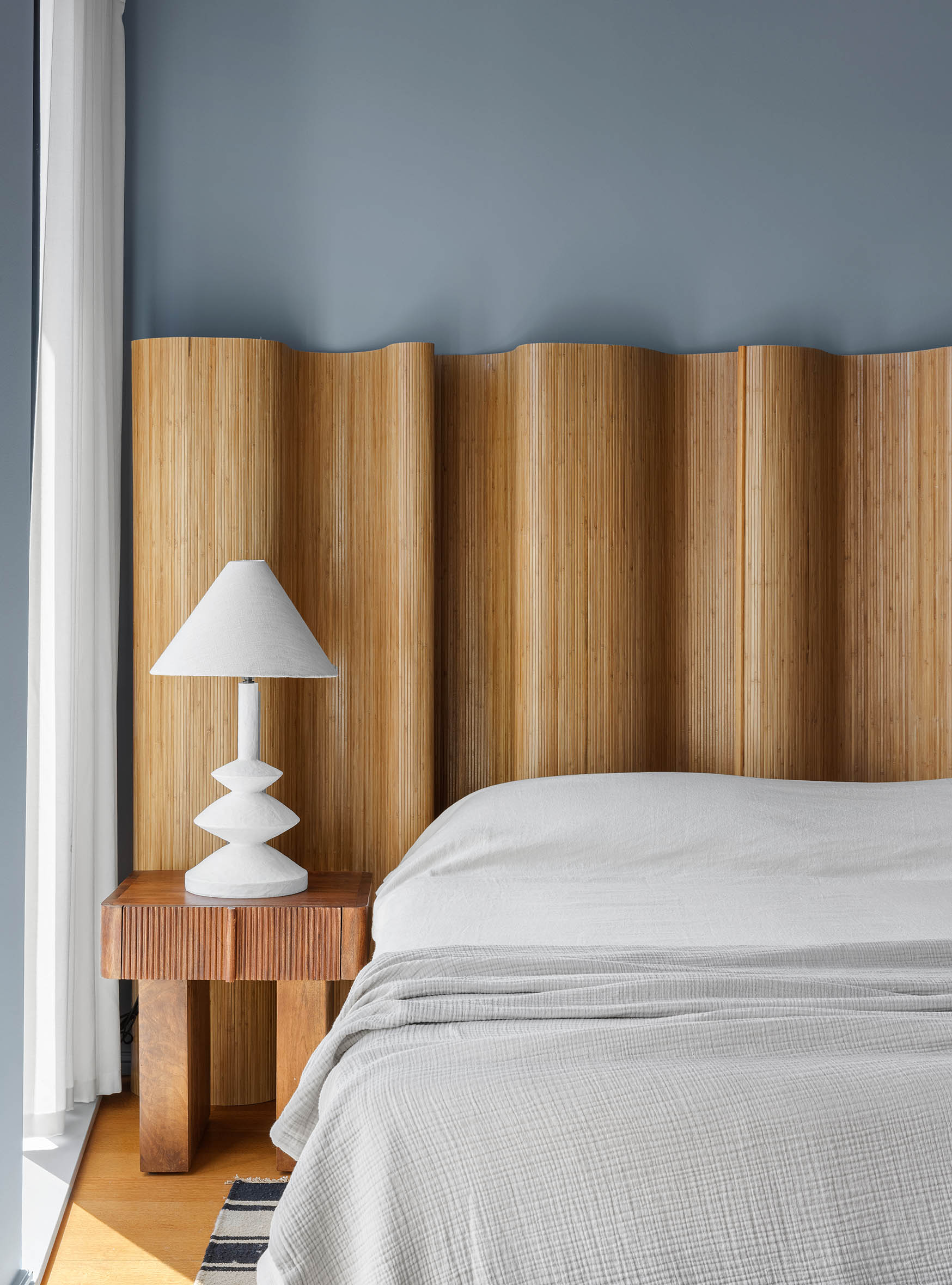 505 West 19th Street, Unit PH1 Manhattan, NY 10011 - Photo 21 of 26 a bedroom with a bed and a lamp