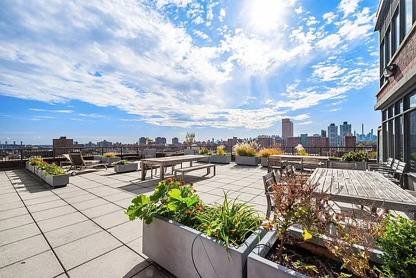 1485 5th Avenue, Unit 24F Manhattan, NY 10035 - Photo 15 of 16 a view of a terrace with chairs