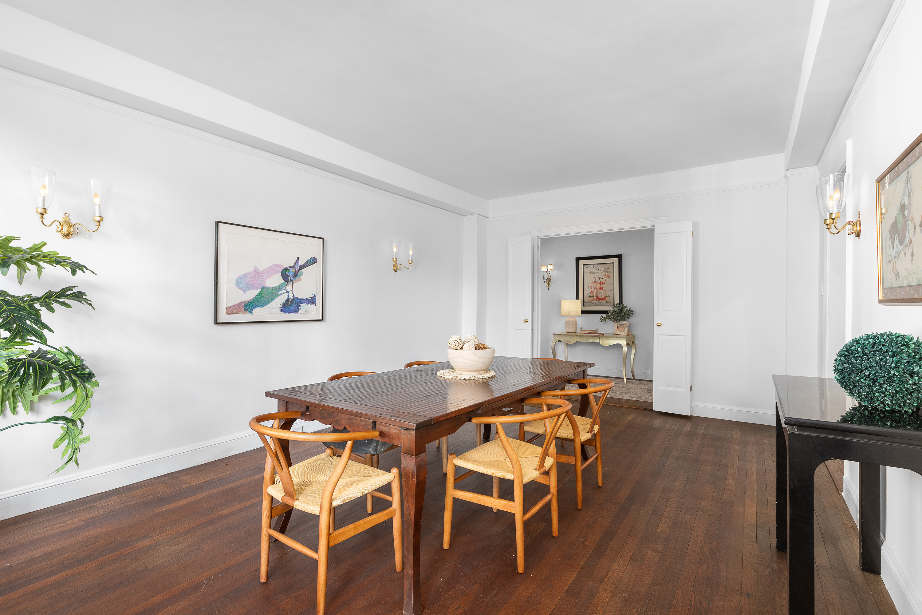 1088 Park Avenue, Unit 15C Manhattan, NY 10128 - Photo 9 of 26 a view of a dining room with furniture and wooden floor