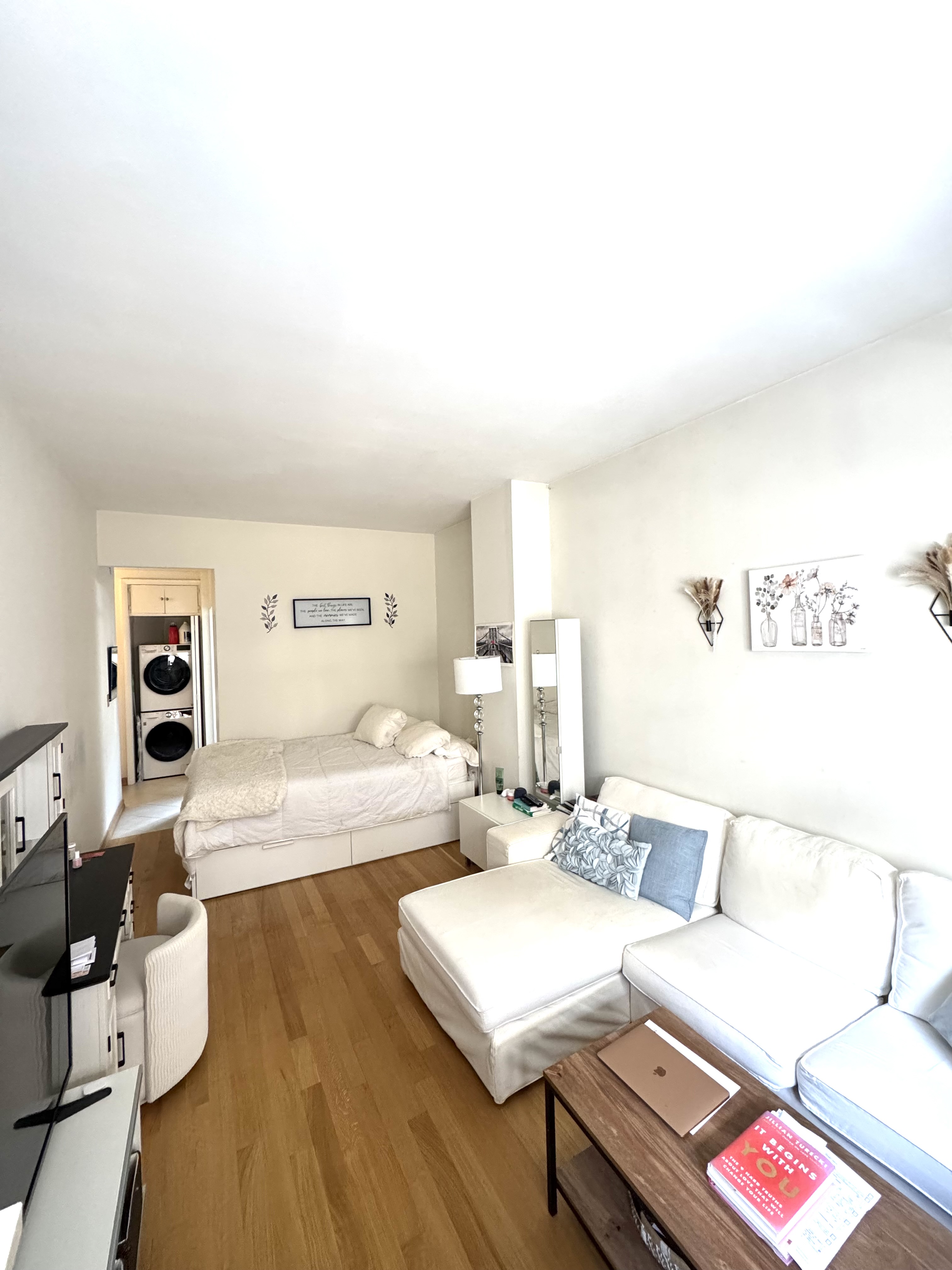 61 East 77th Street, Unit 7E Manhattan, NY 10075 - Photo 2 of 10 a living room with furniture and a table