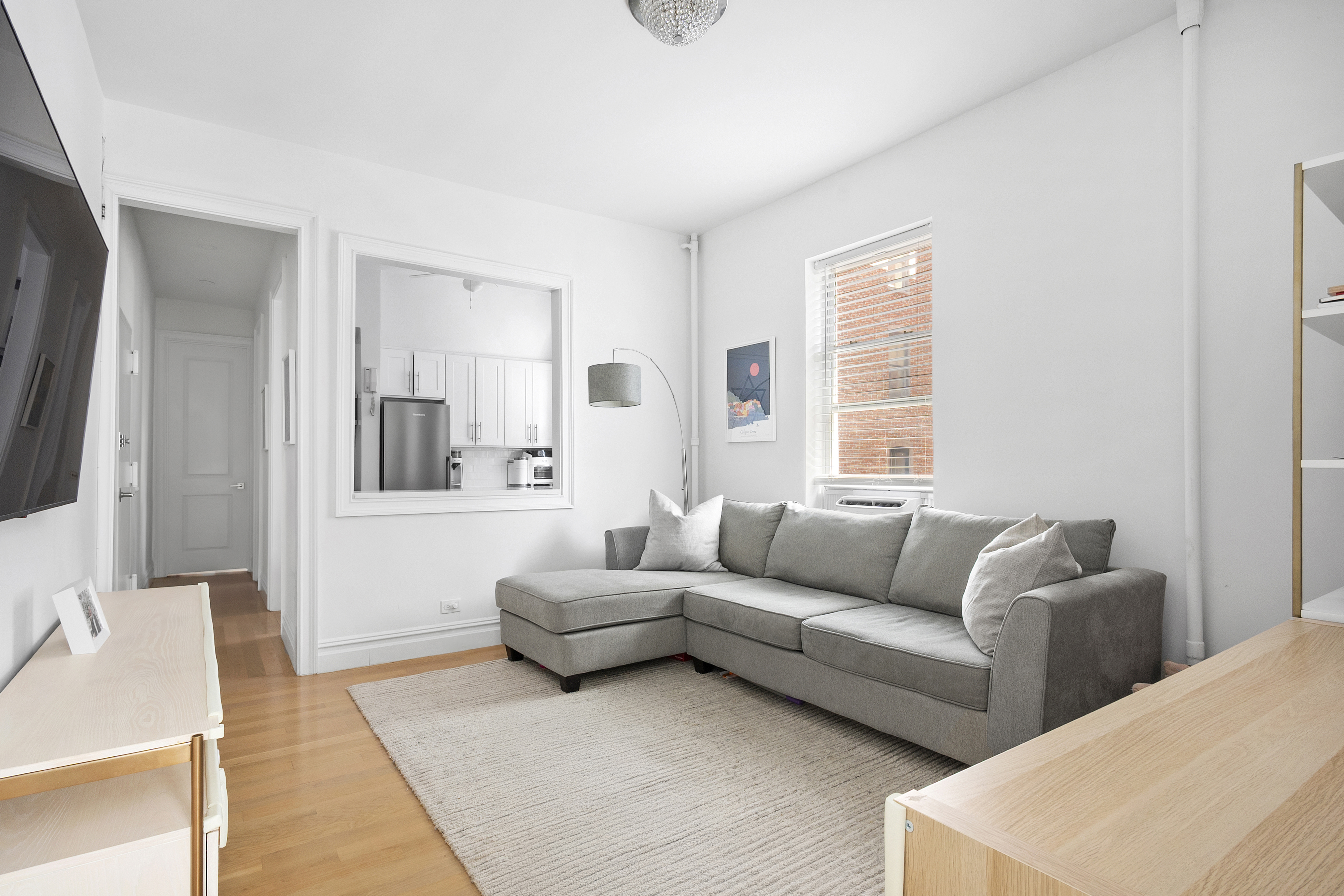 345 West 70th Street, Unit 5E Manhattan, NY 10023 - Photo 2 of 10 a living room with furniture and a couch