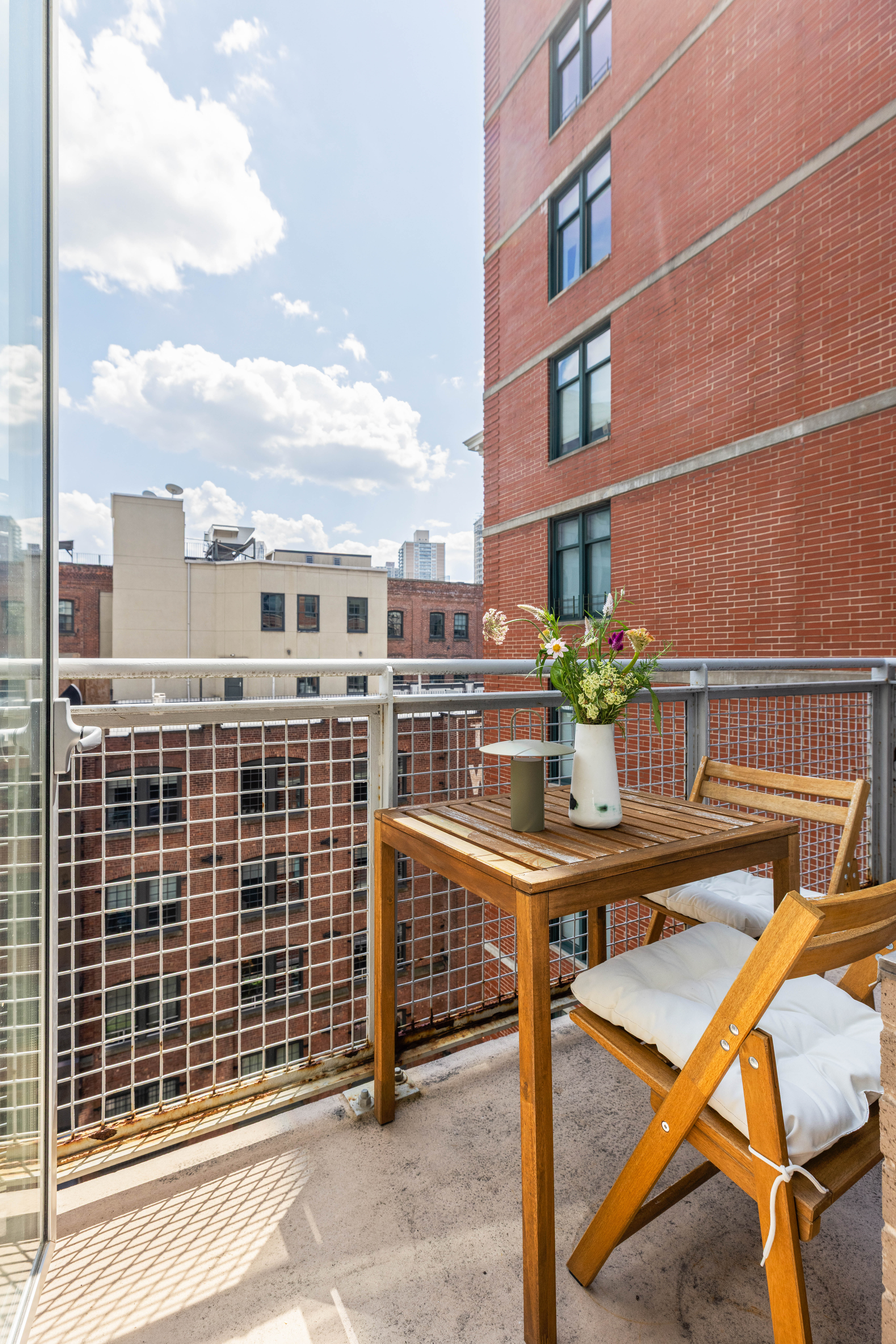 84 Front Street, Unit 8F Brooklyn, NY 11201 - Photo 11 of 12 a view of a balcony with chairs