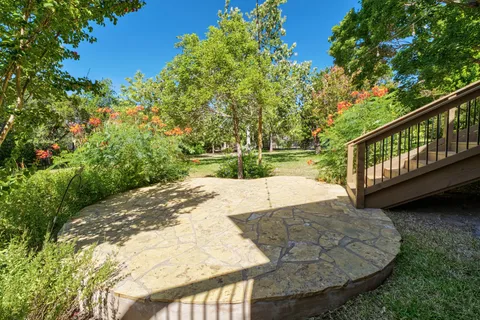 a view of a swimming pool with a yard