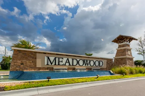 a view of swimming pool with outdoor seating and yard