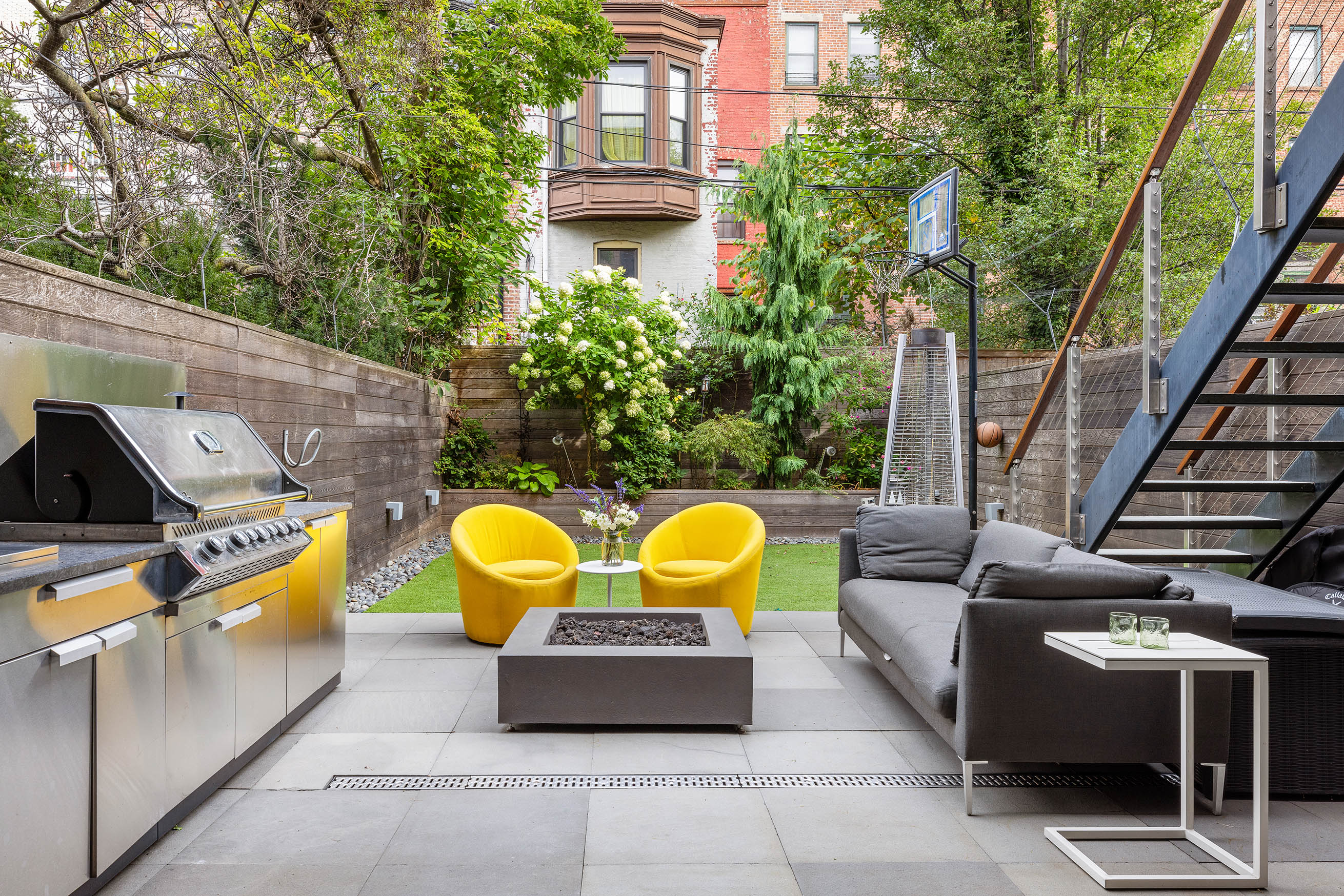 49 Rutland Road Brooklyn, NY 11225 - Photo 7 of 22 a view of a swimming pool with couches chairs and potted plants