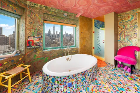 a very nice looking room with a large window and a table