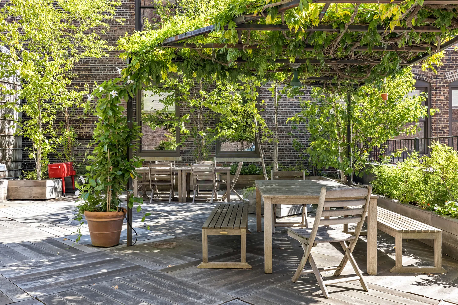 a view of a patio with table and chairs and potted plants