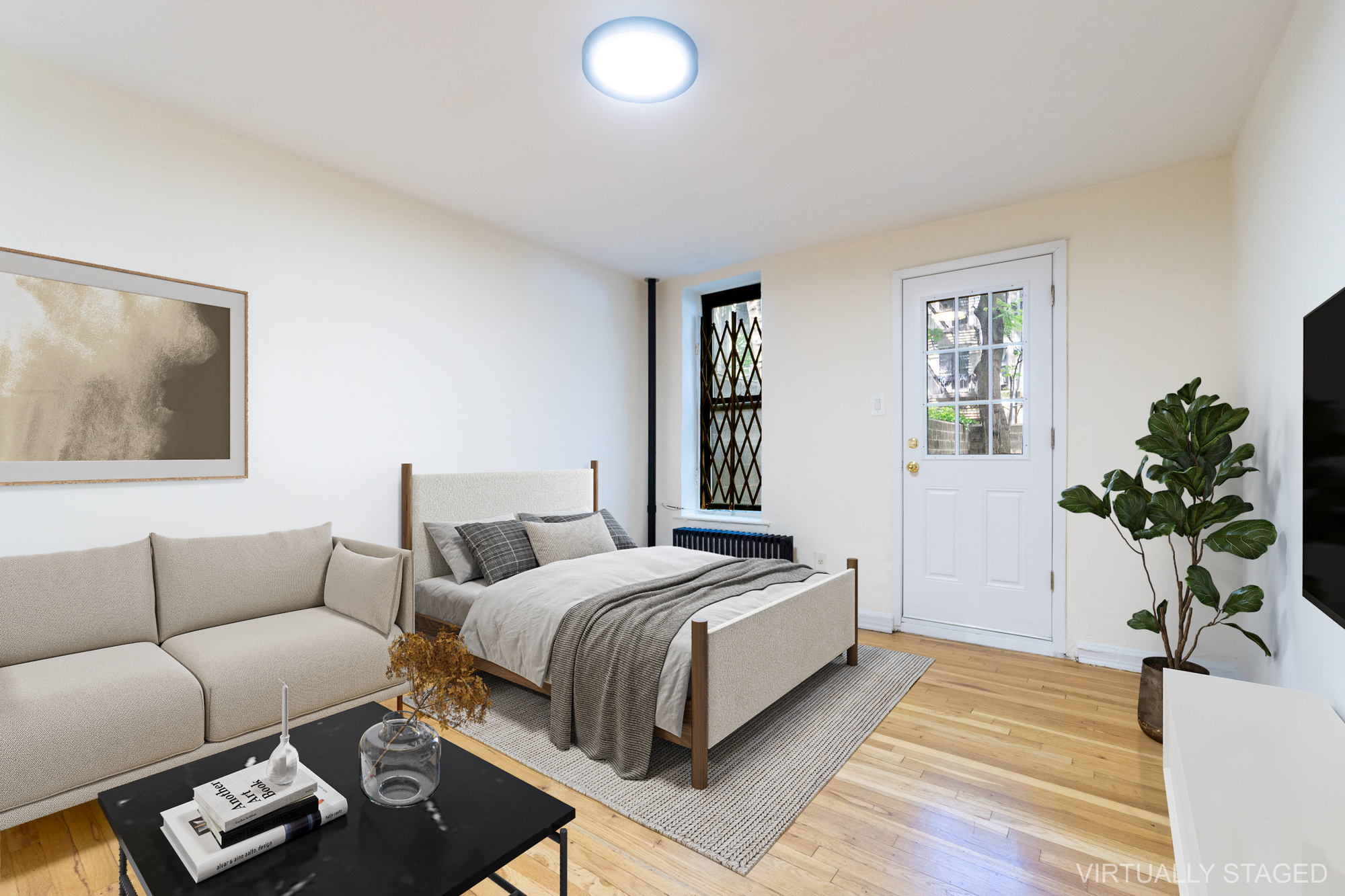 319 East 5th Street, Unit B Manhattan, NY 10003 - Photo 5 of 17 a bedroom with a bed couch and window