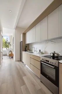 a kitchen with a stove a sink and a refrigerator