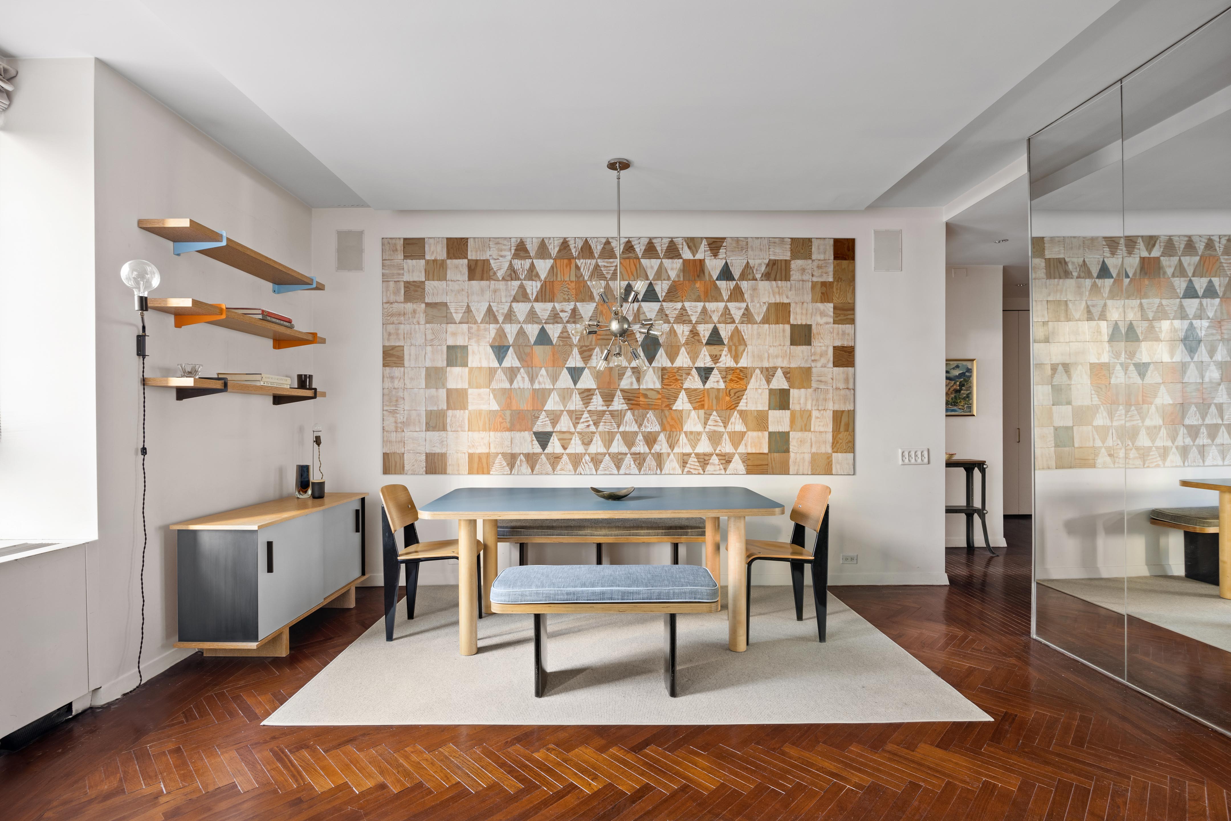 15 West 53rd Street, Unit 10H Manhattan, NY 10019 - Photo 2 of 11 a living room with furniture and a window