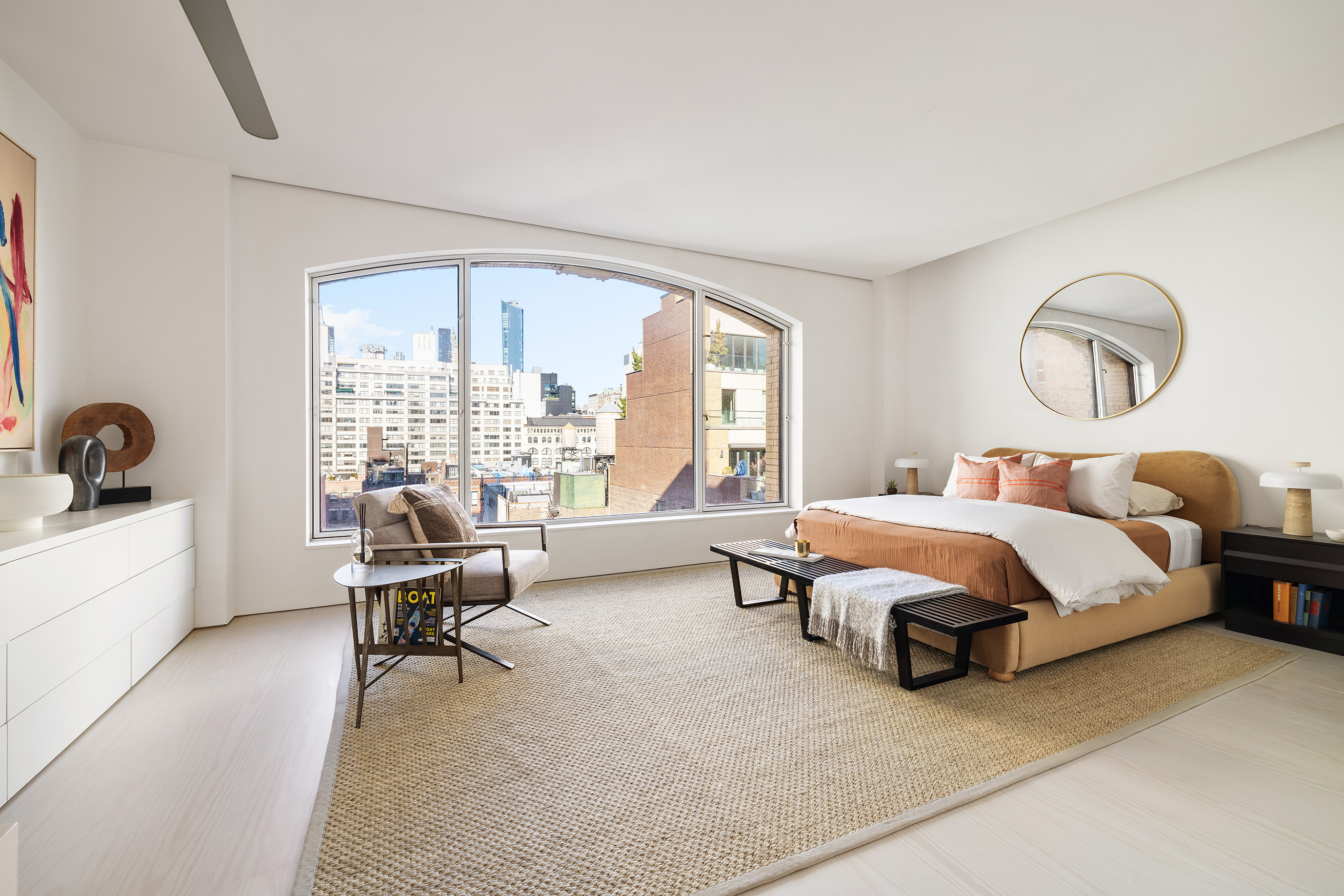 12 East 12th Street, Unit 9NS Manhattan, NY 10003 - Photo 15 of 21 a spacious bedroom with a bed and a large window