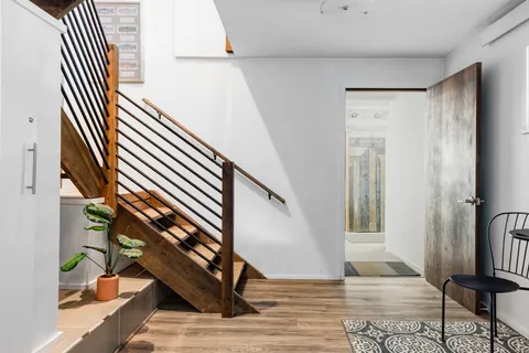 a view of entryway with wooden floor