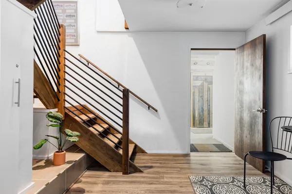 a view of entryway with wooden floor