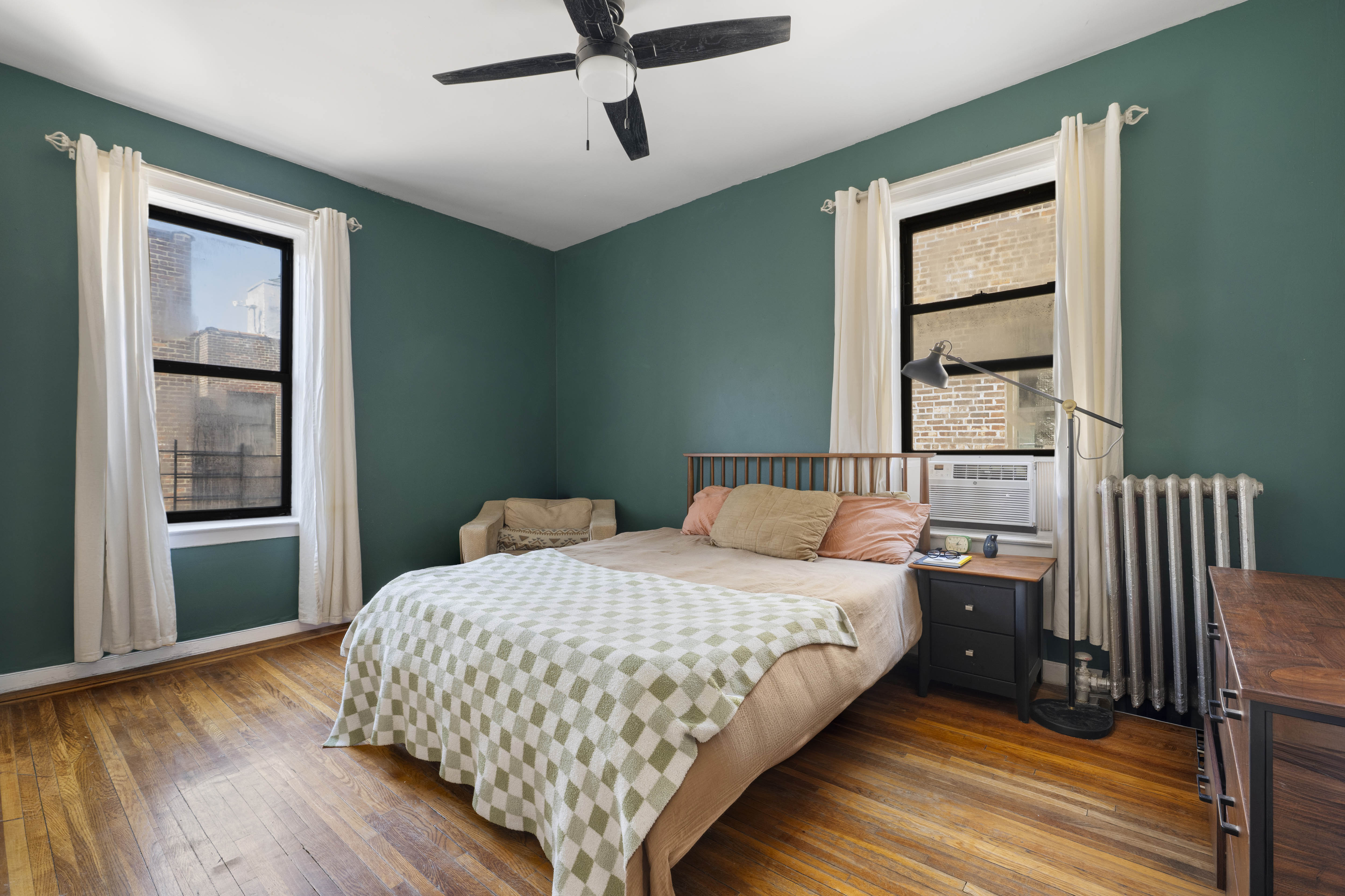 2199 Holland Avenue, Unit 5P Bronx, NY 10462 - Photo 7 of 11 a bedroom with a bed and a window