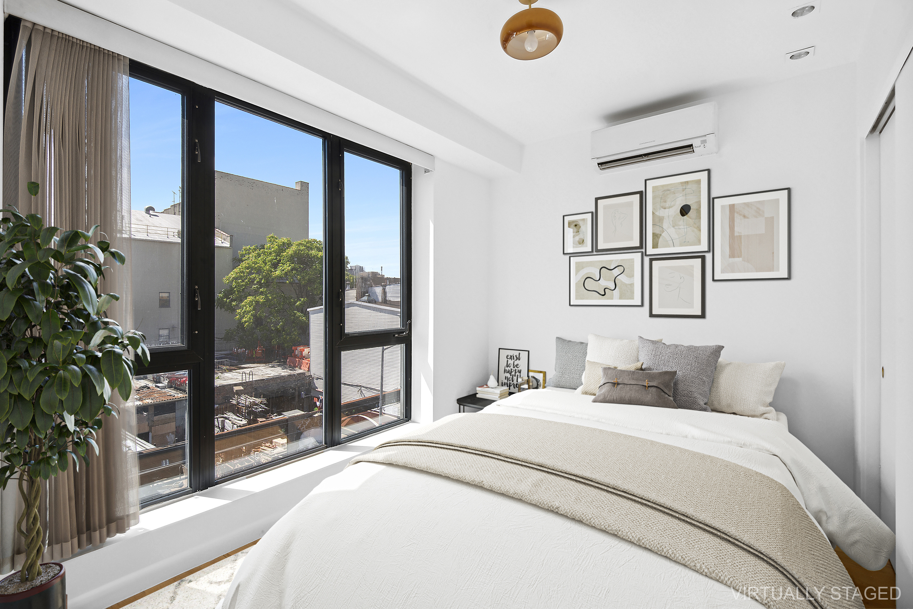 27 Dodworth Street, Unit PHF Brooklyn, NY 11221 - Photo 3 of 18 a bedroom with a large bed and a potted plant