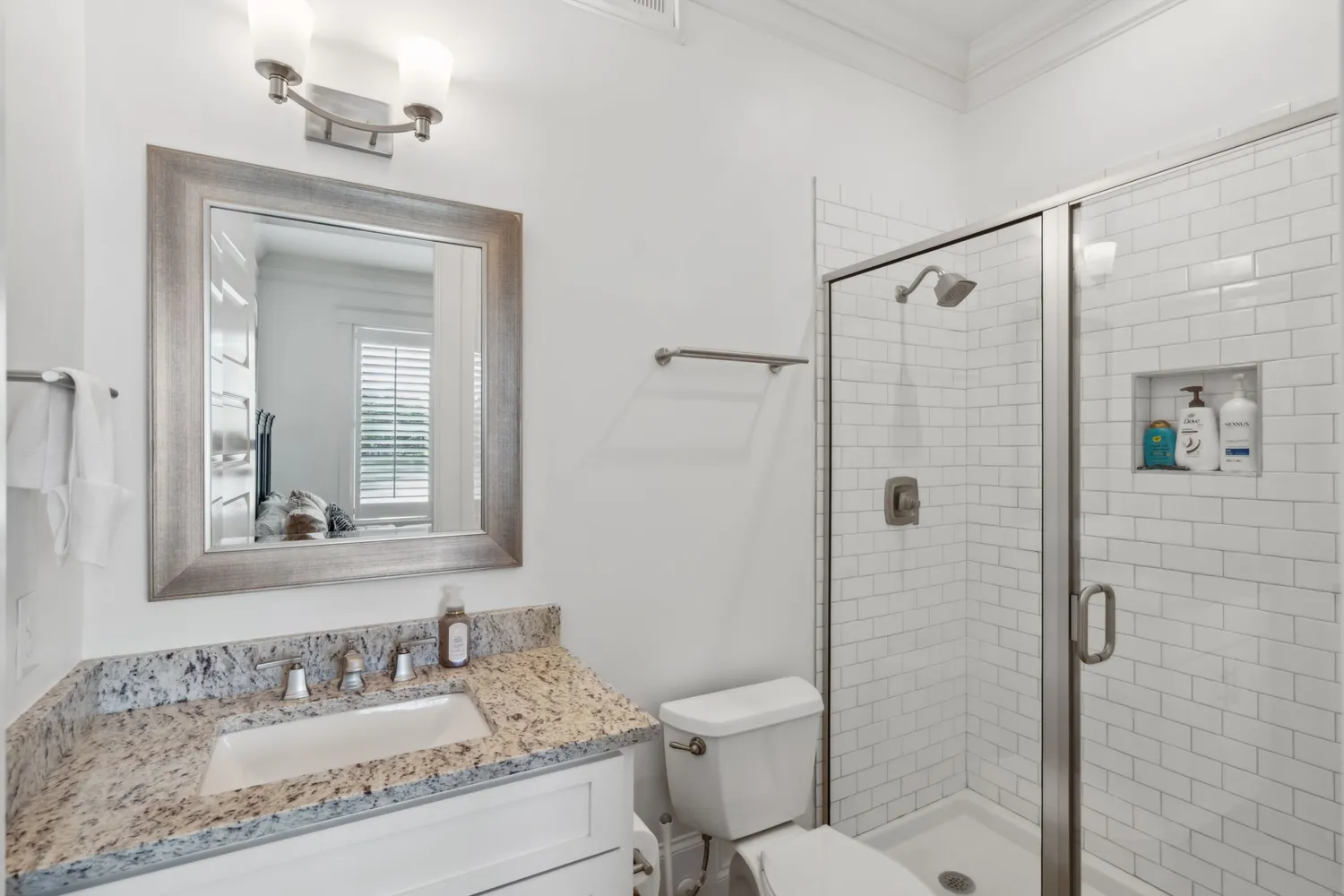 a utility room with granite countertop cabinets washer and dryer