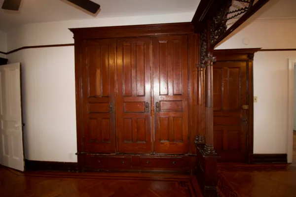 an empty room with wooden floor