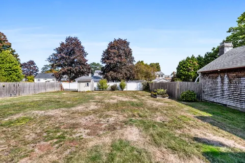 a view of backyard with green space