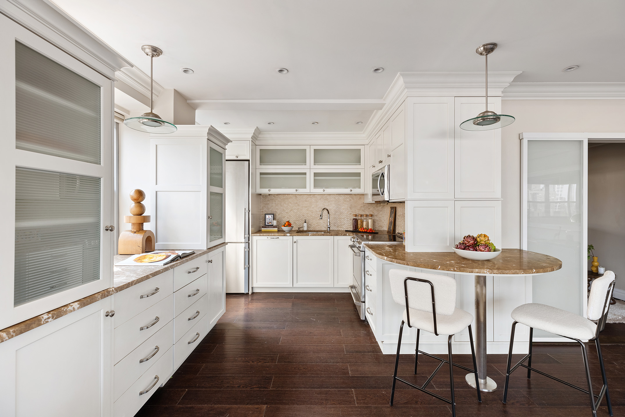 80 Park Avenue, Unit 19N Manhattan, NY 10016 - Photo 12 of 20 a kitchen with granite countertop white cabinets and stainless steel appliances