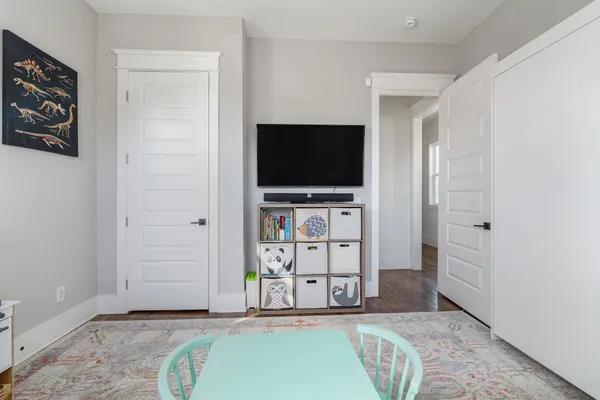 a view of a room with wooden walls