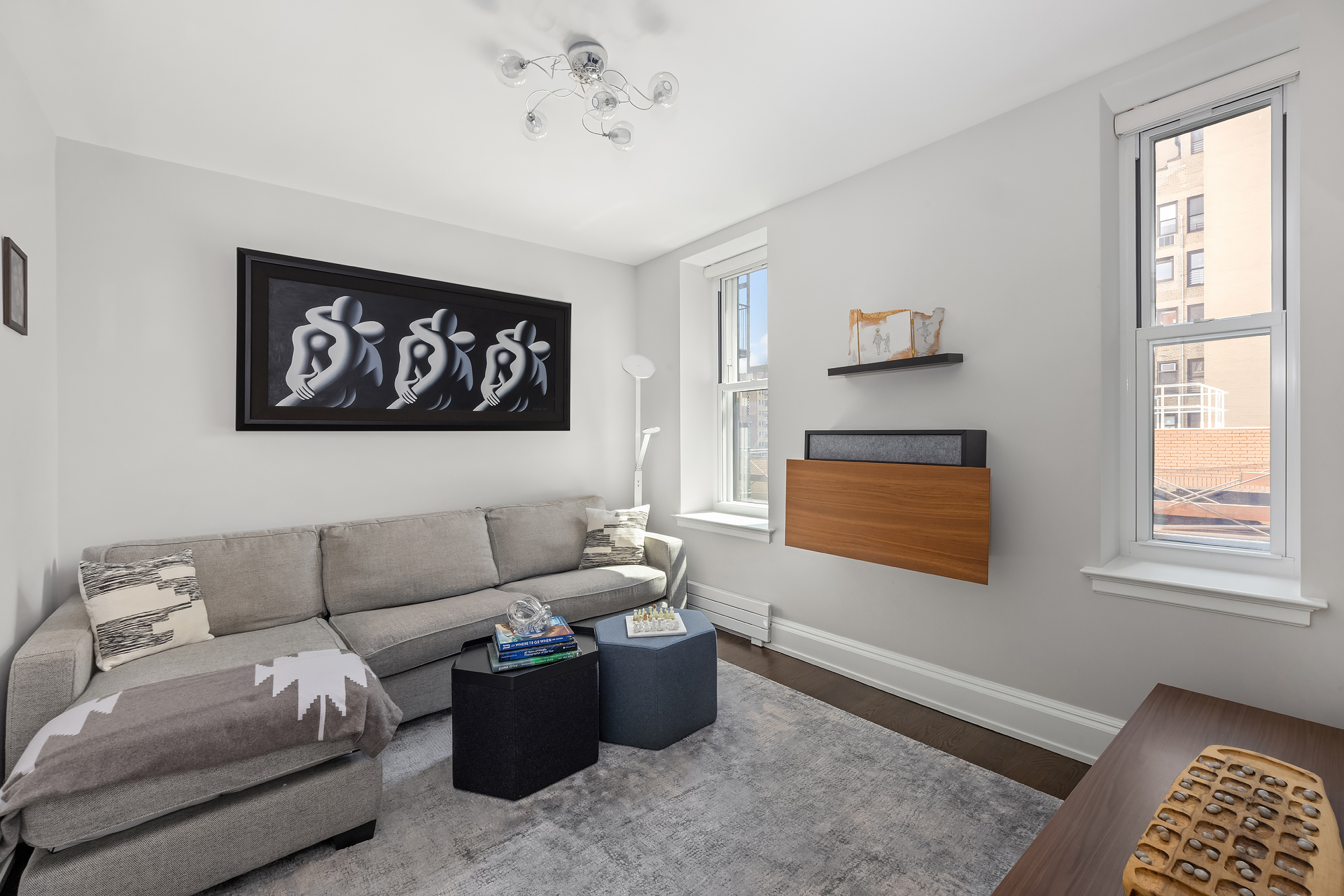 344 West 72nd Street, Unit 1007 Manhattan, NY 10023 - Photo 15 of 23 a living room with furniture and window