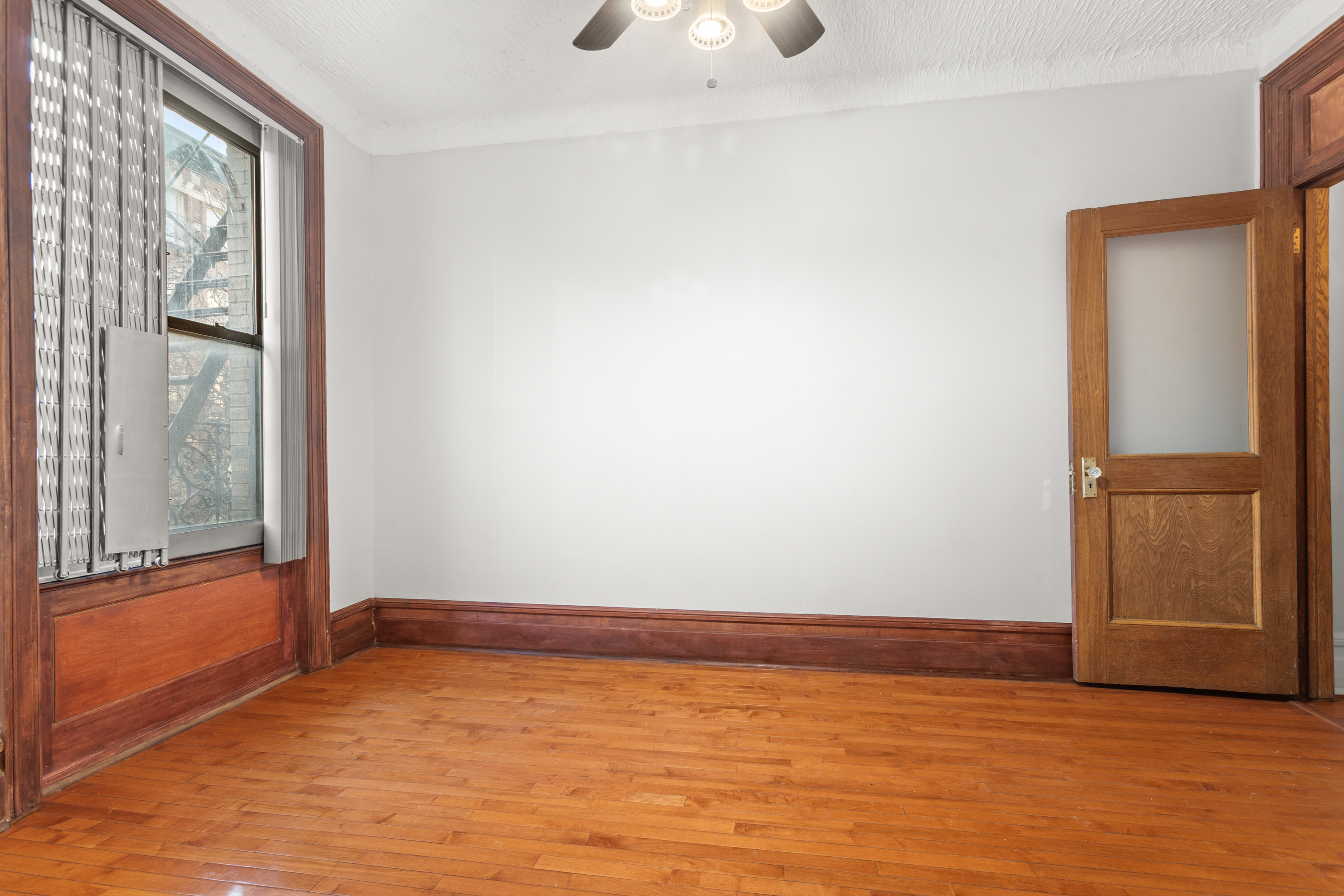 527 West 143rd Street, Unit 31 Manhattan, NY 10031 - Photo 20 of 29 wooden floor in an empty room