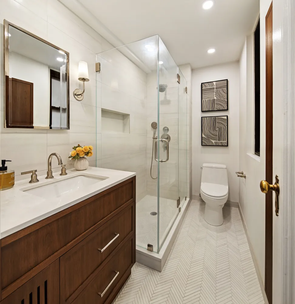 a spacious bathroom with a granite countertop sink mirror and toilet