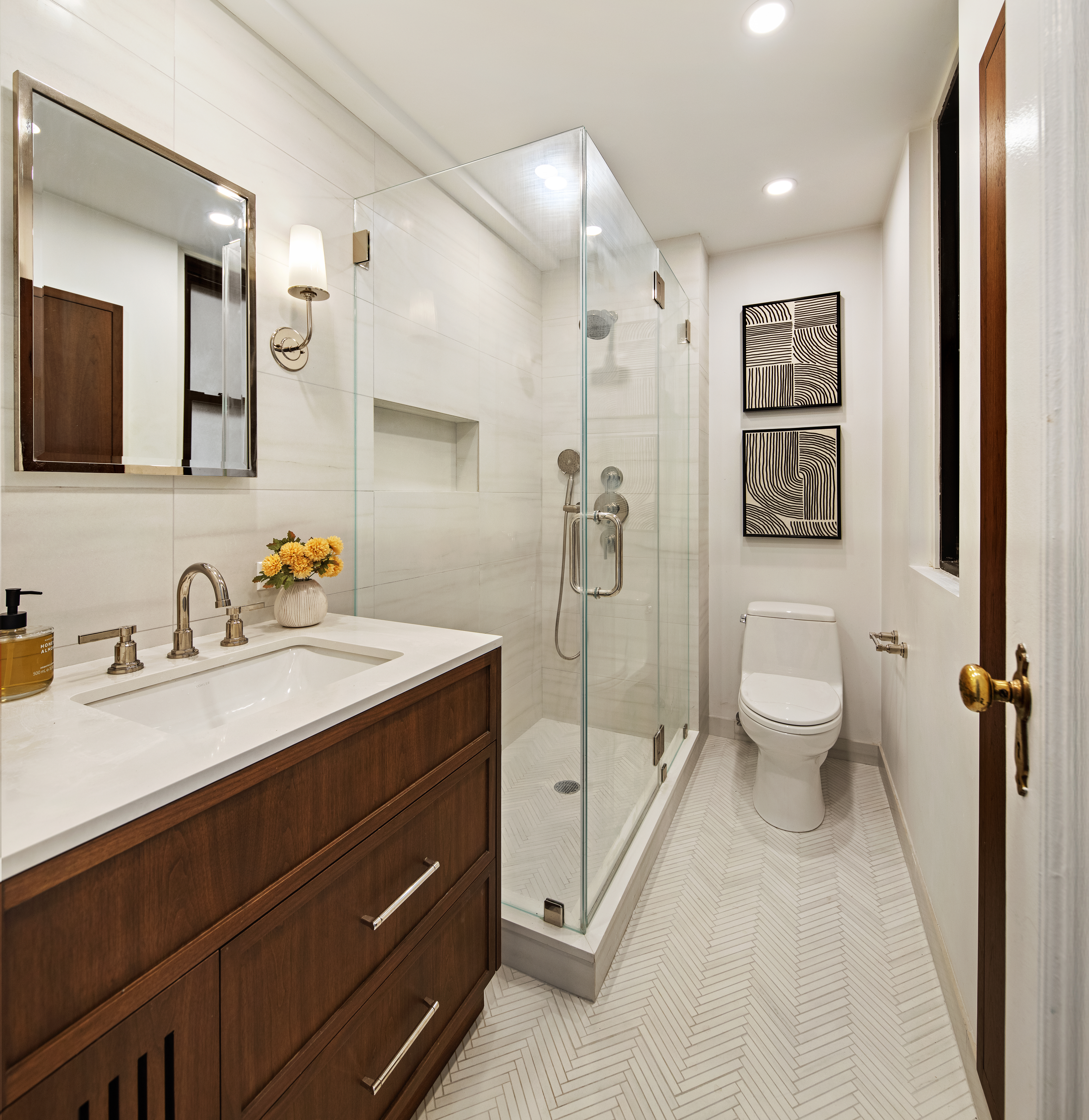 308 East 79th Street, Unit 10G Manhattan, NY 10075 - Photo 7 of 10 a spacious bathroom with a granite countertop sink mirror and toilet