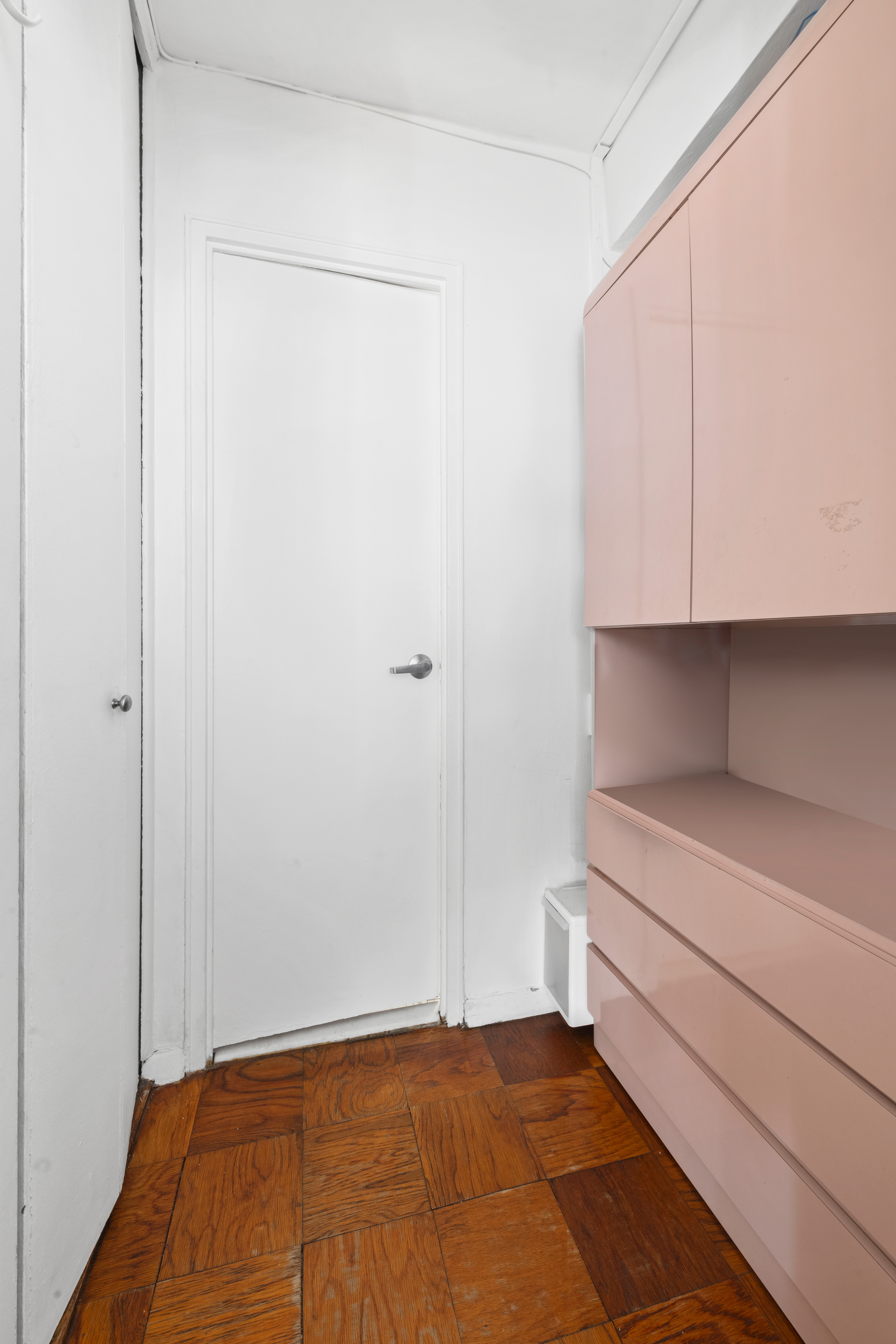 130 East 18th Street, Unit 3K Manhattan, NY 10003 - Photo 8 of 9 a view of an empty room with cabinet