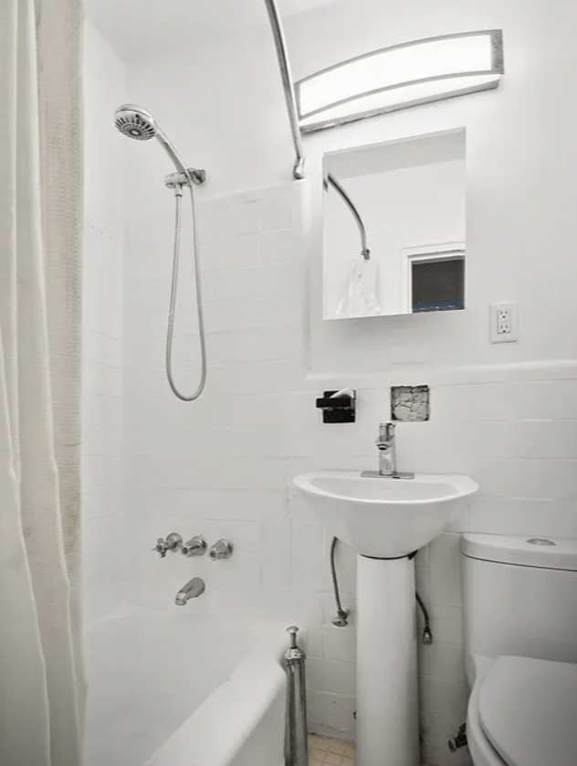 397 Clermont Avenue, Unit 3R Brooklyn, NY 11238 - Photo 5 of 8 a bathroom with a sink a toilet and shower